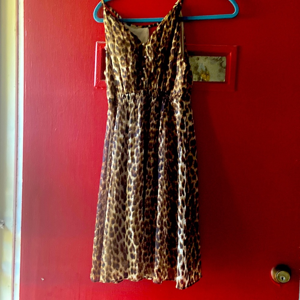 This dress has never been worn. I bought it at a boutique. It is small.